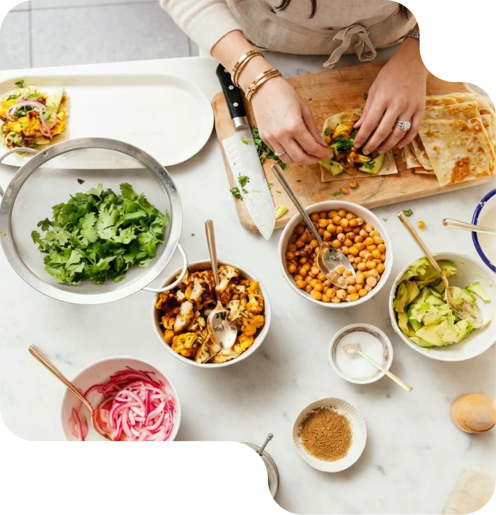 Chef preparing fresh, balanced meals with fresh vegetables and grains